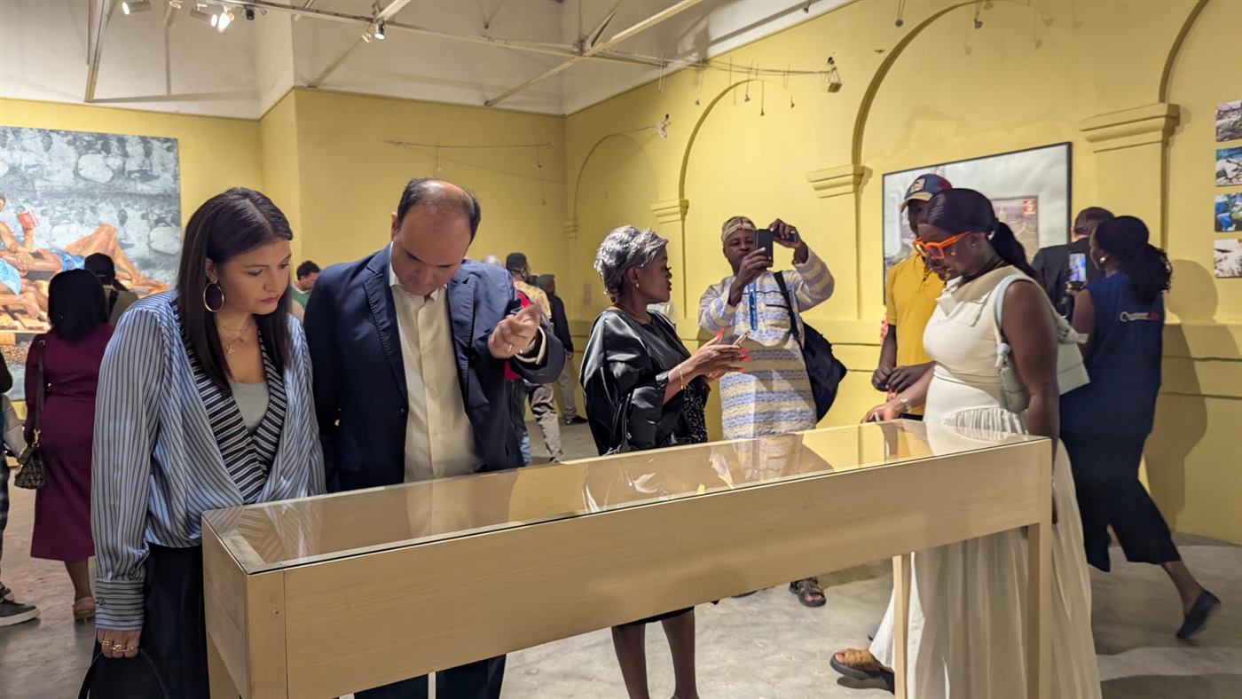 Visitors exploring an exhibition at a cultural venue in Douala