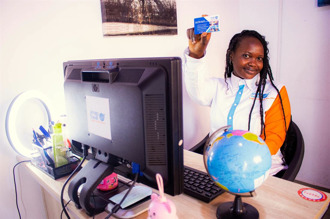 An advisor presenting a travel booking at the office